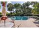 Relaxing community pool with lounge chairs, tables, and umbrellas for shade and comfort at 410 Yacht Harbor Ct # 410, Isle of Palms, SC 29451