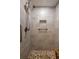 Modern tiled shower with grab bar, overhead shower, and mosaic flooring for a luxurious spa experience at 410 Yacht Harbor Ct # 410, Isle of Palms, SC 29451