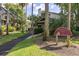 Community entrance with Yacht Harbor Villas signage and lush landscaping at 410 Yacht Harbor Ct # 410, Isle of Palms, SC 29451