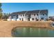 Beautiful backyard view of newly built townhomes and a small lake at 420 Duskywing Dr, Goose Creek, SC 29445