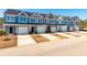 New townhomes feature craftsman style elevations, private garages, and inviting curb appeal at 420 Duskywing Dr, Goose Creek, SC 29445
