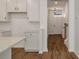 Stylish kitchen featuring white cabinets, granite countertops, and subway tile backsplash at 420 Duskywing Dr, Goose Creek, SC 29445
