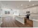 Open kitchen design features stainless steel appliances, island with sink, and access to living area at 420 Duskywing Dr, Goose Creek, SC 29445