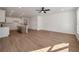Spacious living room with modern kitchen island and ceiling fan at 420 Duskywing Dr, Goose Creek, SC 29445