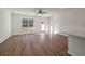 Sun-filled living room featuring wood floors, ceiling fan, and backyard access at 420 Duskywing Dr, Goose Creek, SC 29445