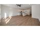 Bright, open-concept living space featuring wood floors and a modern kitchen with an island at 420 Duskywing Dr, Goose Creek, SC 29445