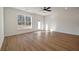 Bright living room with wood floors, a window and glass door to the backyard at 420 Duskywing Dr, Goose Creek, SC 29445