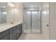Bright bathroom featuring double sink vanity, quartz countertops, and a modern walk-in shower at 422 Duskywing Dr, Goose Creek, SC 29445