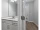 Well-lit bathroom featuring a modern vanity with quartz countertop and sleek fixtures at 422 Duskywing Dr, Goose Creek, SC 29445