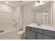 The bathroom includes a shower-tub combo, single sink vanity, and a large, well-lit mirror at 422 Duskywing Dr, Goose Creek, SC 29445