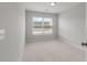 Neutral bedroom with a window that allows plenty of natural light to illuminate the entire room at 422 Duskywing Dr, Goose Creek, SC 29445
