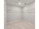 Spacious walk-in closet with carpet flooring and white wire shelving for ample storage at 422 Duskywing Dr, Goose Creek, SC 29445