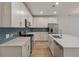 Bright kitchen boasts quartz counters, modern appliances, and beautiful tile backsplash at 422 Duskywing Dr, Goose Creek, SC 29445
