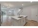 Open concept design features a kitchen island that flows into a spacious living area with backyard access at 422 Duskywing Dr, Goose Creek, SC 29445