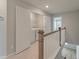 Upstairs laundry room includes washer, dryer, and white shelving in a closet with double doors at 422 Duskywing Dr, Goose Creek, SC 29445