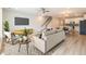 Open-concept living room flows into the kitchen, creating an inviting space for relaxation and entertaining at 422 Duskywing Dr, Goose Creek, SC 29445