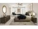 Spacious main bedroom featuring plush carpeting, a ceiling fan, and an abundance of natural light at 422 Duskywing Dr, Goose Creek, SC 29445
