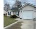 Exterior view of a well maintained home with a driveway and an attached single car garage at 429 Stephanie Dr, Goose Creek, SC 29445