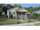 Charming one-story home with a cozy front porch, mature trees, and a fenced-in yard at 47 Oswego St, Charleston, SC 29403