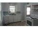 Functional kitchen with white cabinets and vintage stove at 47 Oswego St, Charleston, SC 29403