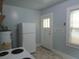 Cozy kitchen featuring white appliances and ample natural light at 47 Oswego St, Charleston, SC 29403