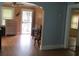 Open-concept living room with hardwood floors and natural light at 47 Oswego St, Charleston, SC 29403