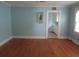 Bright living room with hardwood floors leading to kitchen at 47 Oswego St, Charleston, SC 29403