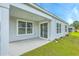 Exterior view of back porch, lawn and well-lit exterior of home and lawn at 505 Shady Maple St, Moncks Corner, SC 29461