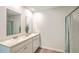 Bathroom featuring a double vanity, large mirror and shower with neutral color palette at 505 Shady Maple St, Moncks Corner, SC 29461