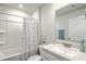 Bright bathroom features a tub/shower combo with stylish curtain and speckled vanity at 505 Shady Maple St, Moncks Corner, SC 29461