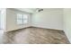 Bright bedroom with large window, wood-look flooring, and plenty of natural light at 505 Shady Maple St, Moncks Corner, SC 29461