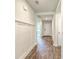Inviting entryway with wood-look flooring, white walls, and decorative trim details at 505 Shady Maple St, Moncks Corner, SC 29461