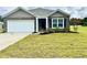 Charming single-story home with brick accents, a two-car garage, and a well-manicured lawn at 505 Shady Maple St, Moncks Corner, SC 29461