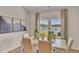 Bright dining room featuring nature-themed artwork and a view of the backyard pond at 544 Verdi Drive Dr, Summerville, SC 29486