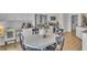 Well-lit kitchen and dining area with stainless steel appliances and white cabinetry at 544 Verdi Drive Dr, Summerville, SC 29486