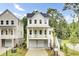 Inviting two-story white home with a covered porch and garage parking at 615 Du Bois Dr, Johns Island, SC 29455