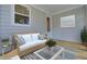 Back porch with couch, coffee table, area rug, and view out window at 617 Du Bois Dr, Johns Island, SC 29455