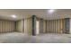 Unfinished basement space with concrete floors, exposed framing, and a utility door, ready for customization at 617 Du Bois Dr, Johns Island, SC 29455