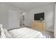 Cozy bedroom featuring a TV and dresser for entertainment, plus a bed with striped bedding for ultimate relaxation at 617 Du Bois Dr, Johns Island, SC 29455