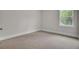 Bright, empty bedroom with neutral colored walls and carpet at 617 Du Bois Dr, Johns Island, SC 29455