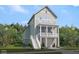 Charming two-story home with a welcoming porch and a well-maintained, landscaped yard at 617 Du Bois Dr, Johns Island, SC 29455