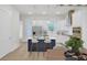 Eat-in kitchen featuring stainless steel appliances, a center island with seating, stylish lighting, and plenty of cabinet space at 617 Du Bois Dr, Johns Island, SC 29455