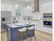 Modern kitchen featuring stainless steel appliances, white cabinets, granite countertops, and a center island with seating at 617 Du Bois Dr, Johns Island, SC 29455