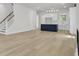 Open-concept living space with hardwood floors and views of the modern kitchen at 617 Du Bois Dr, Johns Island, SC 29455