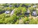 Aerial view of a community nestled among lush, mature trees at 624 Atlantic St, Mount Pleasant, SC 29464
