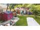 A spacious backyard with well-kept grass, sheds, boats, and a charming home at 624 Atlantic St, Mount Pleasant, SC 29464