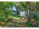 A shed nestled among the trees in a spacious, verdant backyard at 624 Atlantic St, Mount Pleasant, SC 29464