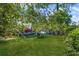 Spacious backyard with boats, sheds, green lawn and a charming house at 624 Atlantic St, Mount Pleasant, SC 29464