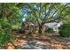 Quaint brick home with well-maintained lawn and shade trees, creating a serene setting at 624 Atlantic St, Mount Pleasant, SC 29464