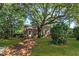 Brick house with a shade tree over the front lawn; driveway along the side leads to the back at 624 Atlantic St, Mount Pleasant, SC 29464